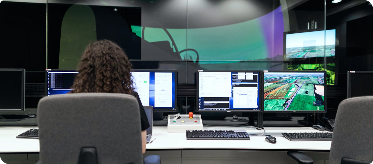 Modern workstation with multiple monitors showing digital content